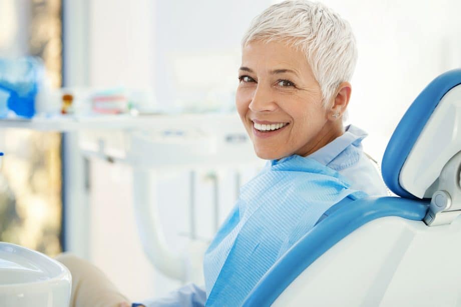 smiling patient in a dental chair