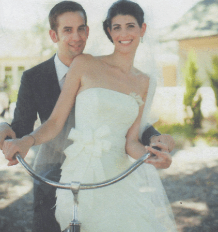wedding photo of couple with bicycle