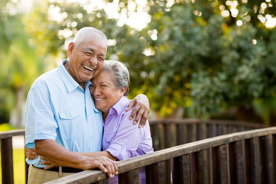 mature couple hugs and smiles together